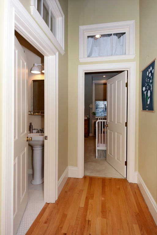 7 Winter Street, Unit 5 Salem, MA 01970 - Photo 23 of 41 a view of a hallway view with wooden floor and staircase