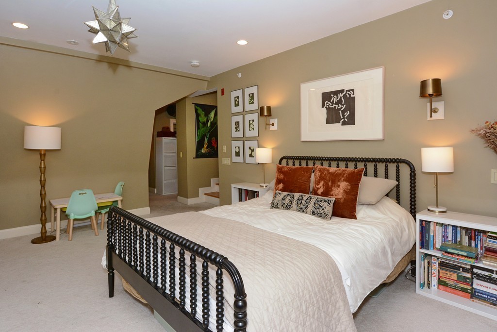 7 Winter Street, Unit 5 Salem, MA 01970 - Photo 27 of 41 a bedroom with a bed and a lamp