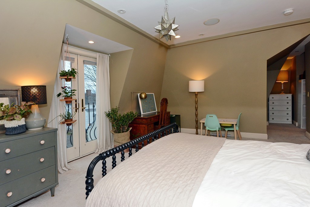 7 Winter Street, Unit 5 Salem, MA 01970 - Photo 28 of 41 a bedroom with a bed and a flat tv screen on dresser