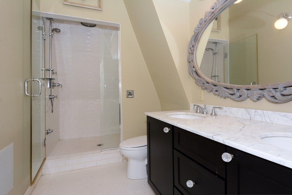 7 Winter Street, Unit 5 Salem, MA 01970 - Photo 29 of 41 a bathroom with a sink a toilet a mirror and shower