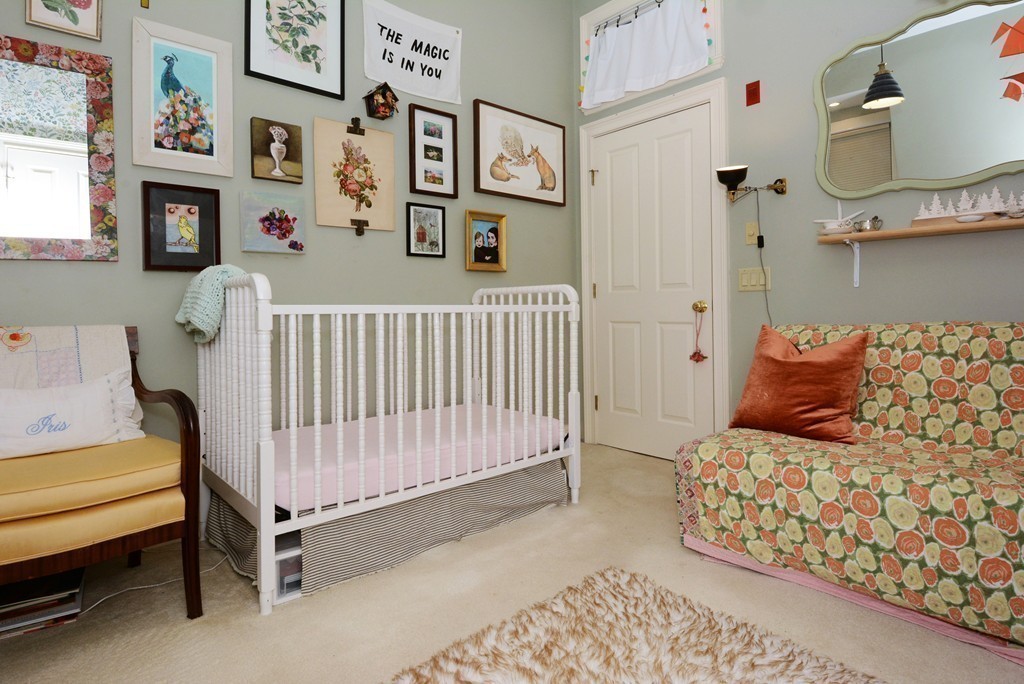 7 Winter Street, Unit 5 Salem, MA 01970 - Photo 33 of 41 a bedroom with furniture and a baby crib