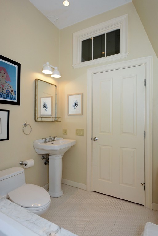 7 Winter Street, Unit 5 Salem, MA 01970 - Photo 35 of 41 a bathroom with a sink toilet and mirror