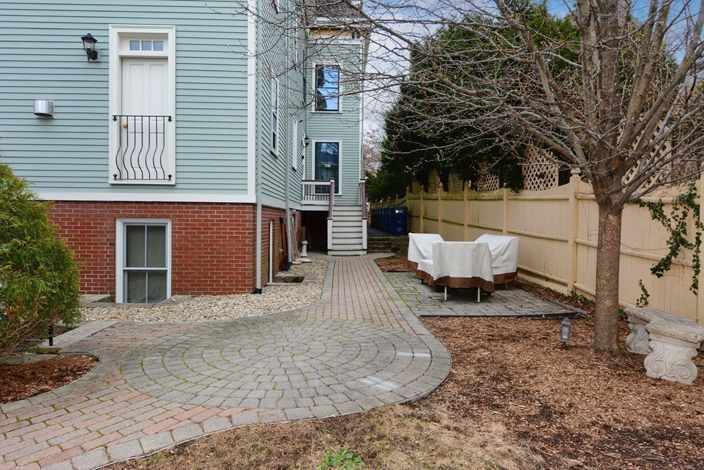 7 Winter Street, Unit 5 Salem, MA 01970 - Photo 36 of 41 a view of a house with a yard and sitting area