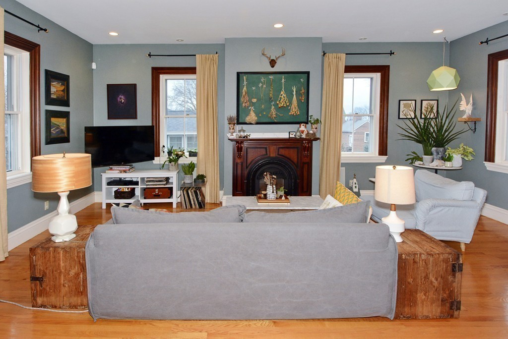 7 Winter Street, Unit 5 Salem, MA 01970 - Photo 10 of 41 a living room with furniture a fireplace and a flat screen tv