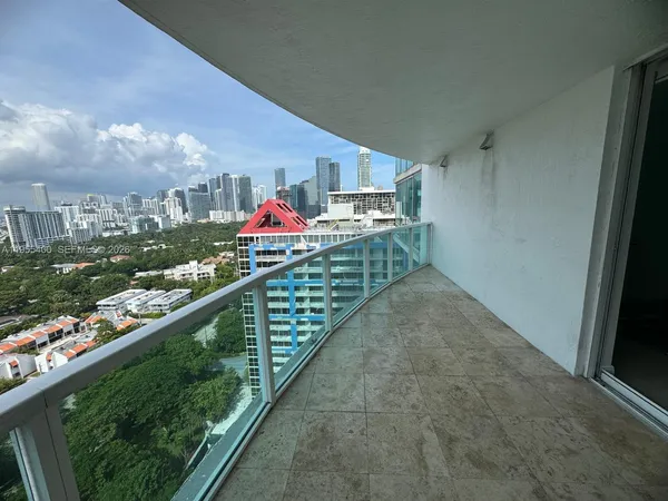 an aerial view of residential building and trees around
