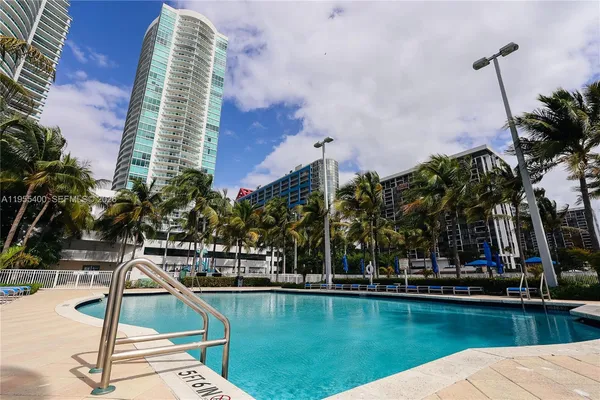 a view of a swimming pool with a lounge chairs