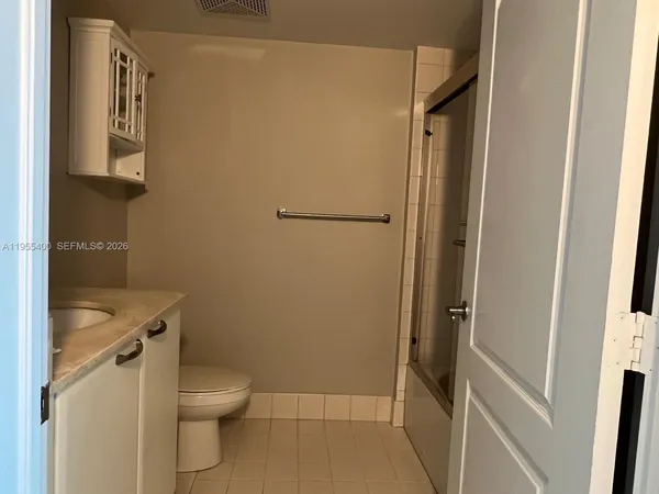 a bathroom with a sink and toilet