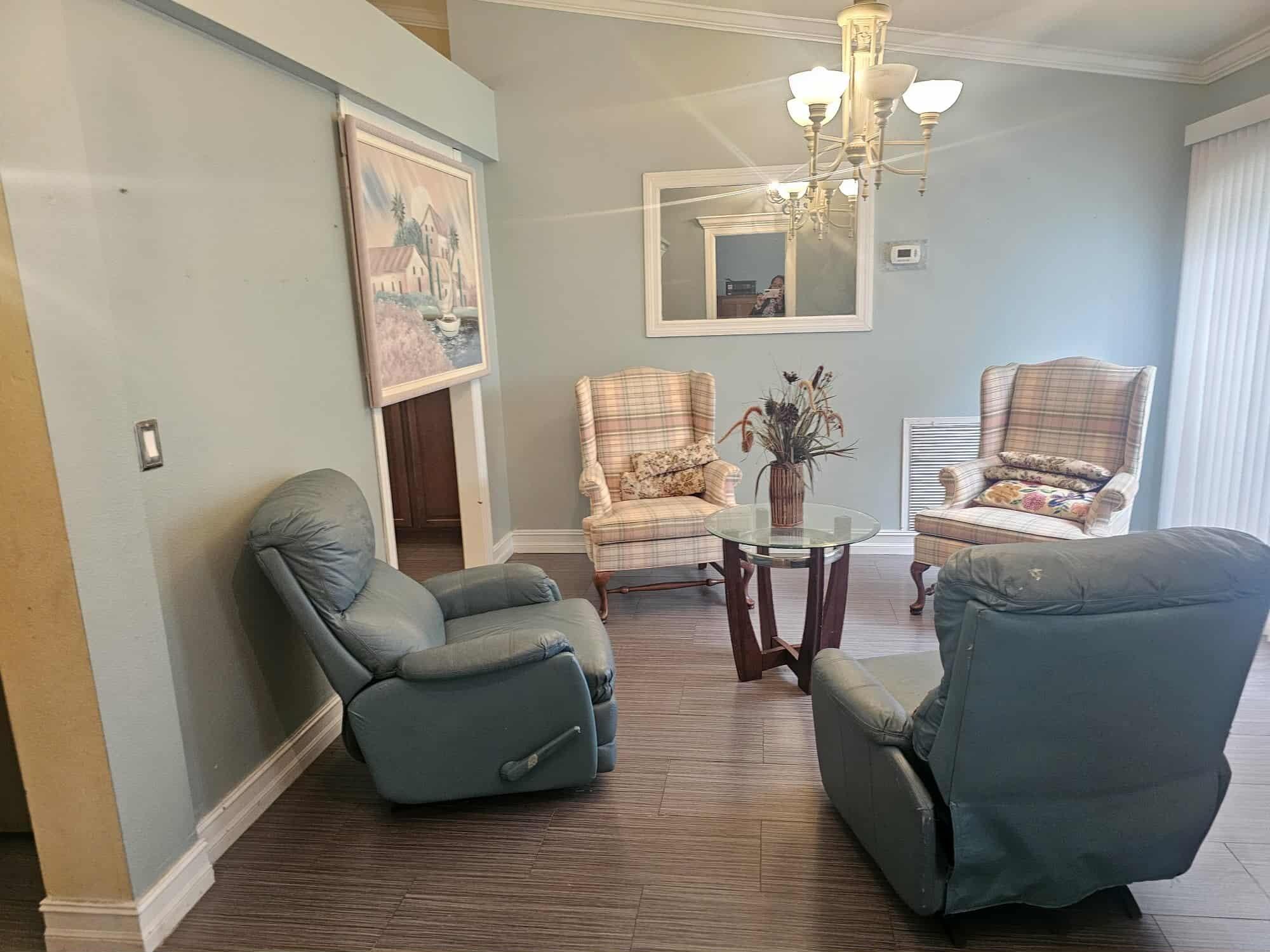 3641 Southwest Parsons Street Port St. Lucie, FL 34953 - Photo 2 of 11 a living room with furniture and a chandelier
