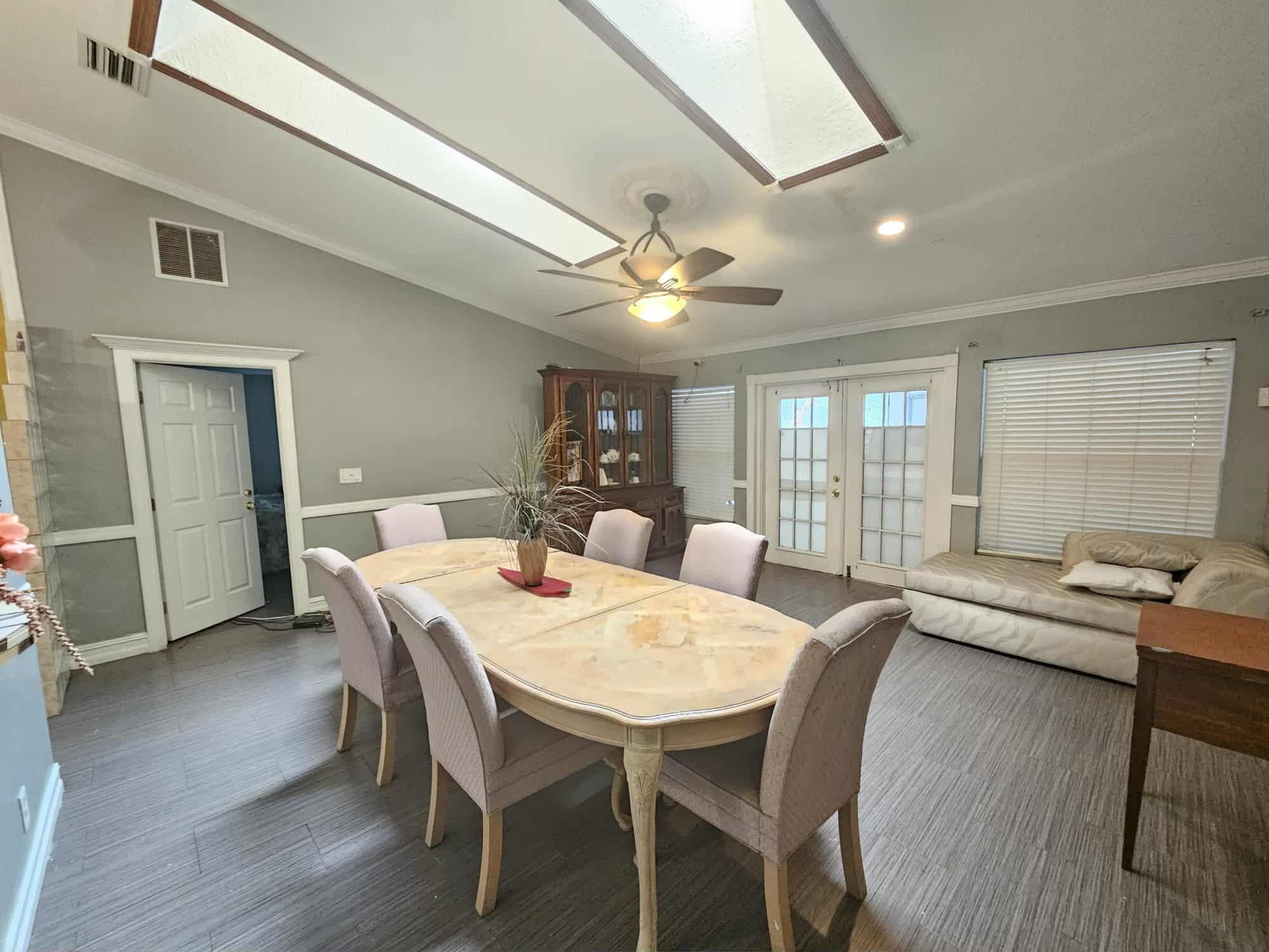 3641 Southwest Parsons Street Port St. Lucie, FL 34953 - Photo 9 of 11 a view of a dining room with furniture window and wooden floor