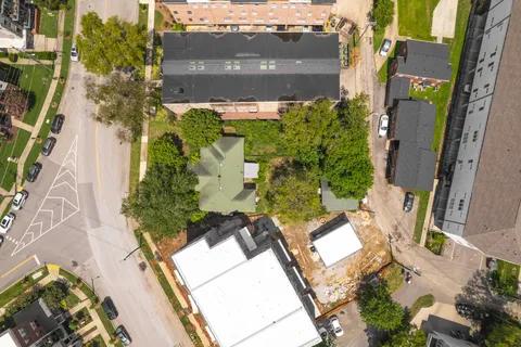 an aerial view of residential houses with outdoor space