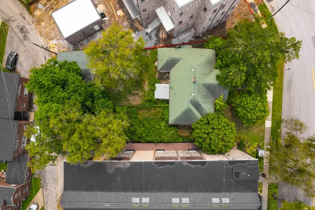 an aerial view of a building with parking space