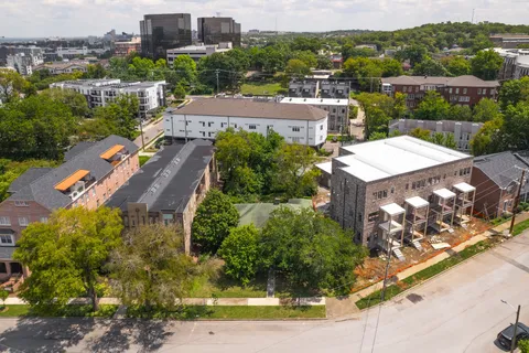 an aerial view of a house with a garden