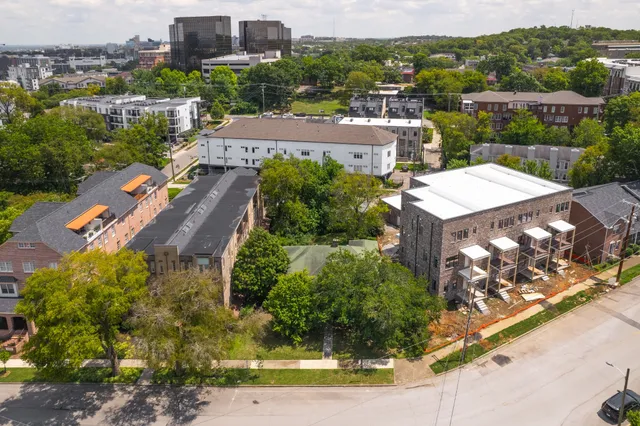 an aerial view of a house with a garden