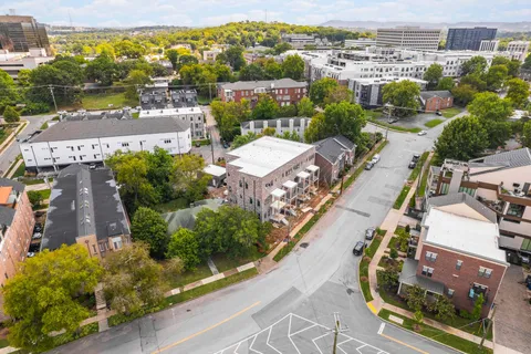 an aerial view of a house with a garden