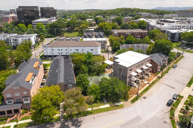 an aerial view of a house with a garden