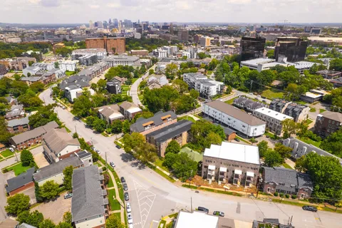 an aerial view of residential houses with outdoor space