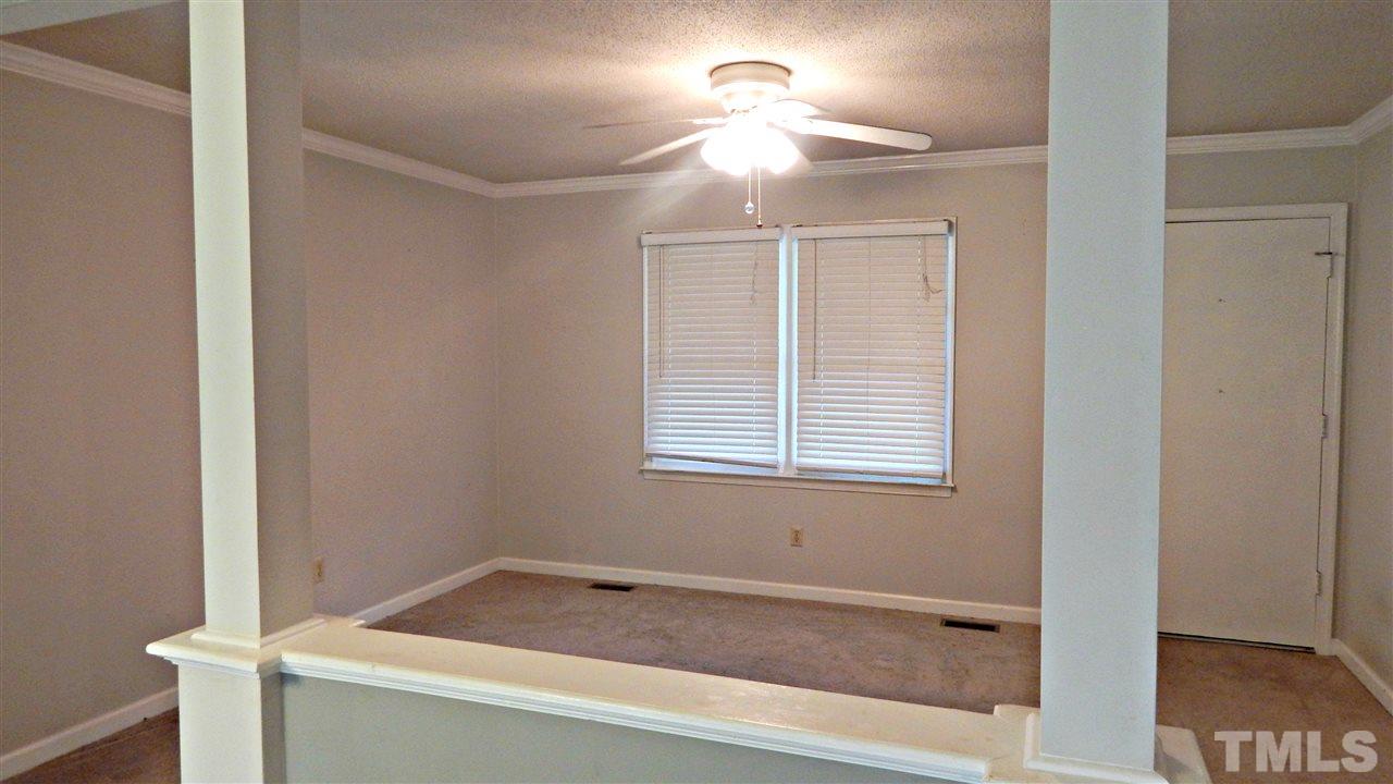5616 Old Stage Road Raleigh, NC 27603 - Photo 3 of 15 a bathroom with a bathtub and a window
