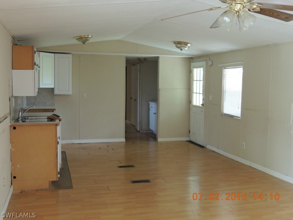 195 G Road LaBelle, FL 33935 - Photo 2 of 9 a view of an empty room with window and cabinet