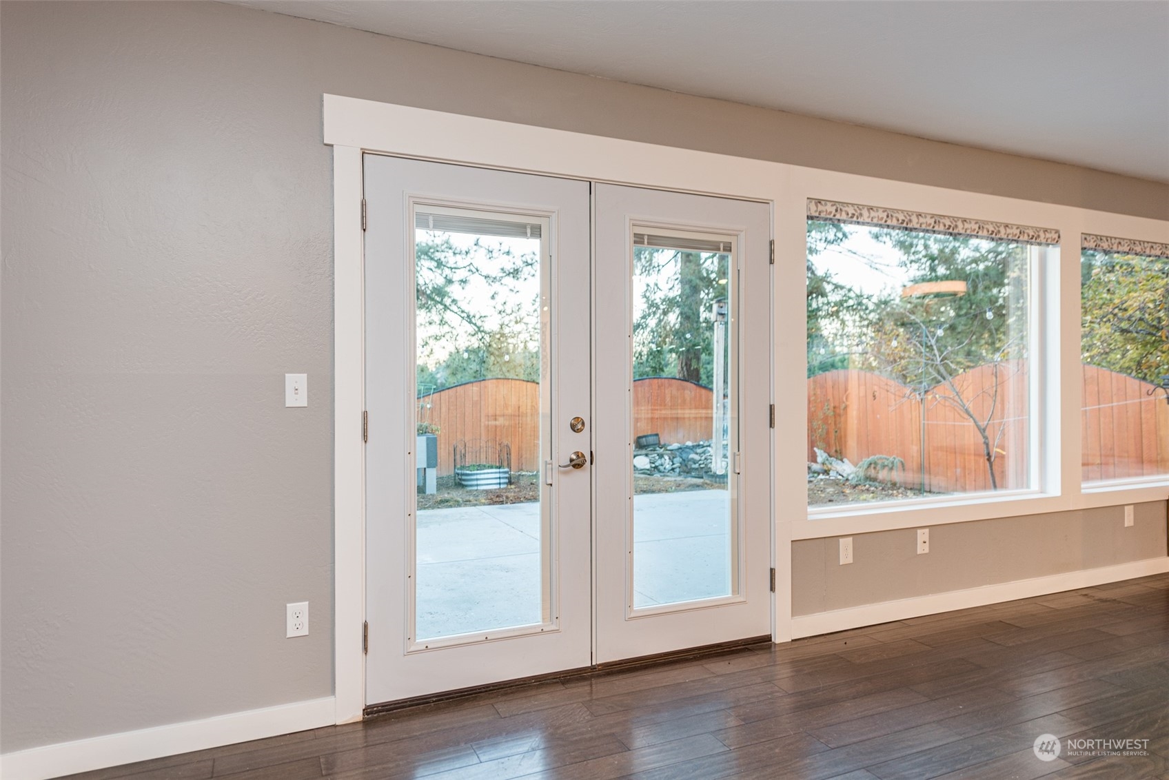 146 Sunset Place Sequim, WA 98382 - Photo 11 of 40 an empty room with wooden floor and windows