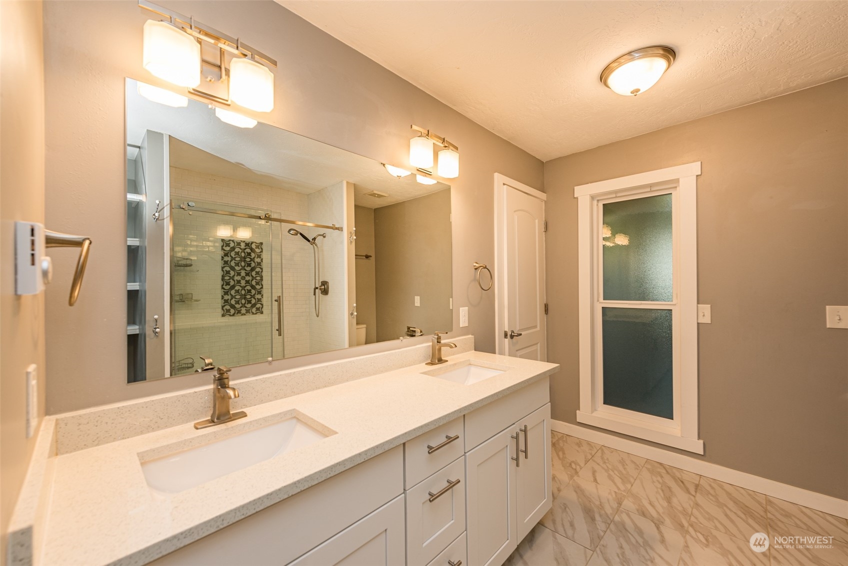 146 Sunset Place Sequim, WA 98382 - Photo 12 of 40 a bathroom with a double vanity sink and a mirror