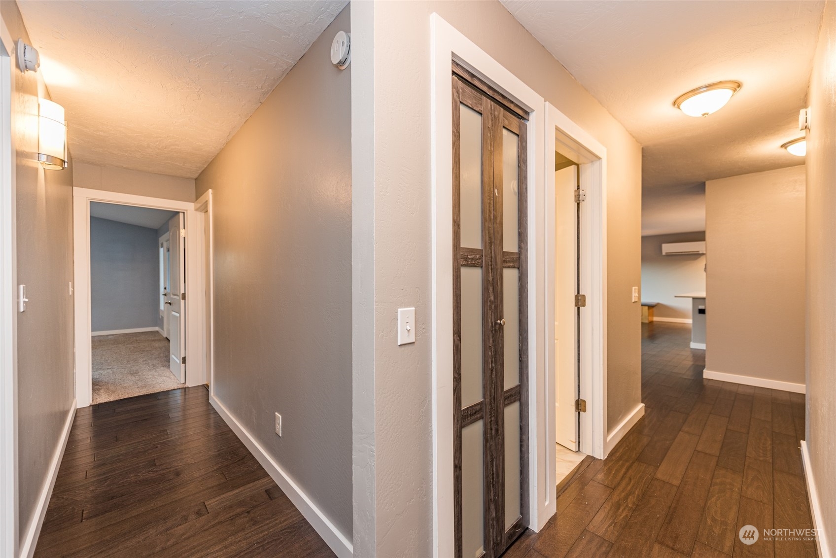 146 Sunset Place Sequim, WA 98382 - Photo 17 of 40 a view of a hallway with a wooden floor