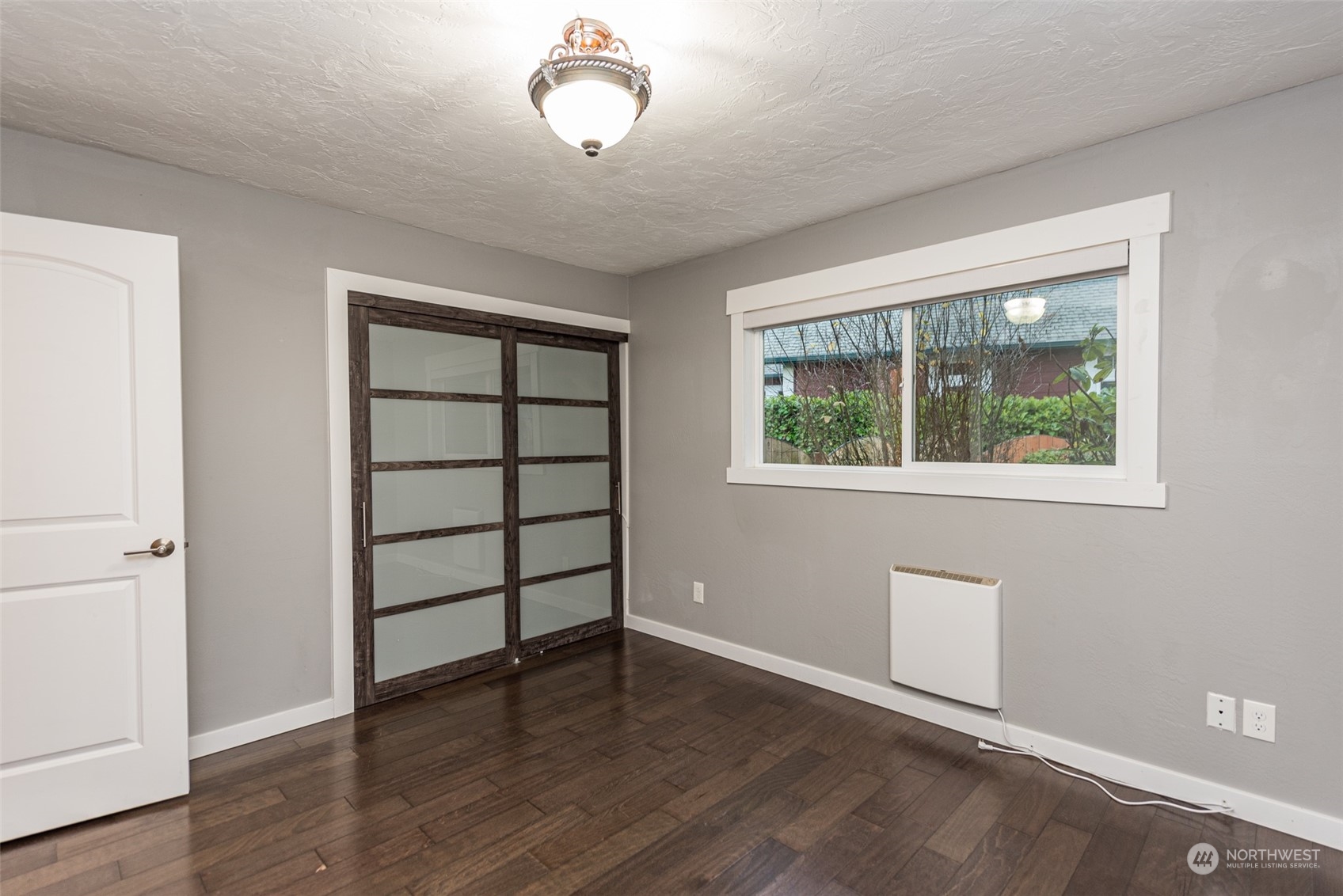 146 Sunset Place Sequim, WA 98382 - Photo 18 of 40 wooden floor in an empty room with a window