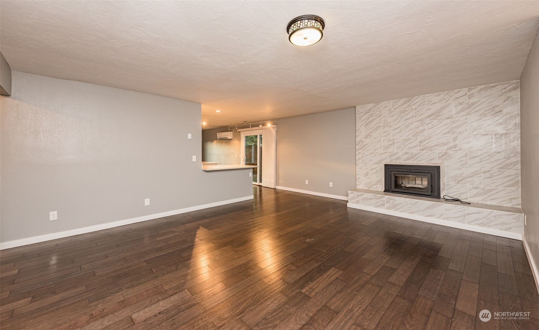 146 Sunset Place Sequim, WA 98382 - Photo 2 of 40 an empty room with wooden floor and windows