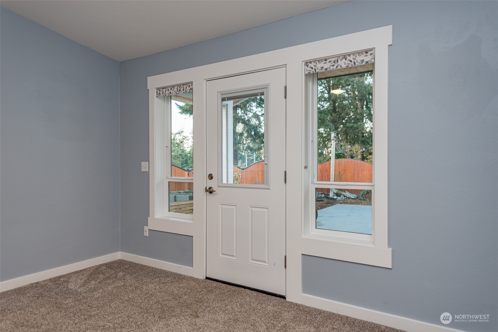 146 Sunset Place Sequim, WA 98382 - Photo 22 of 40 an entryway with wooden floor and windows