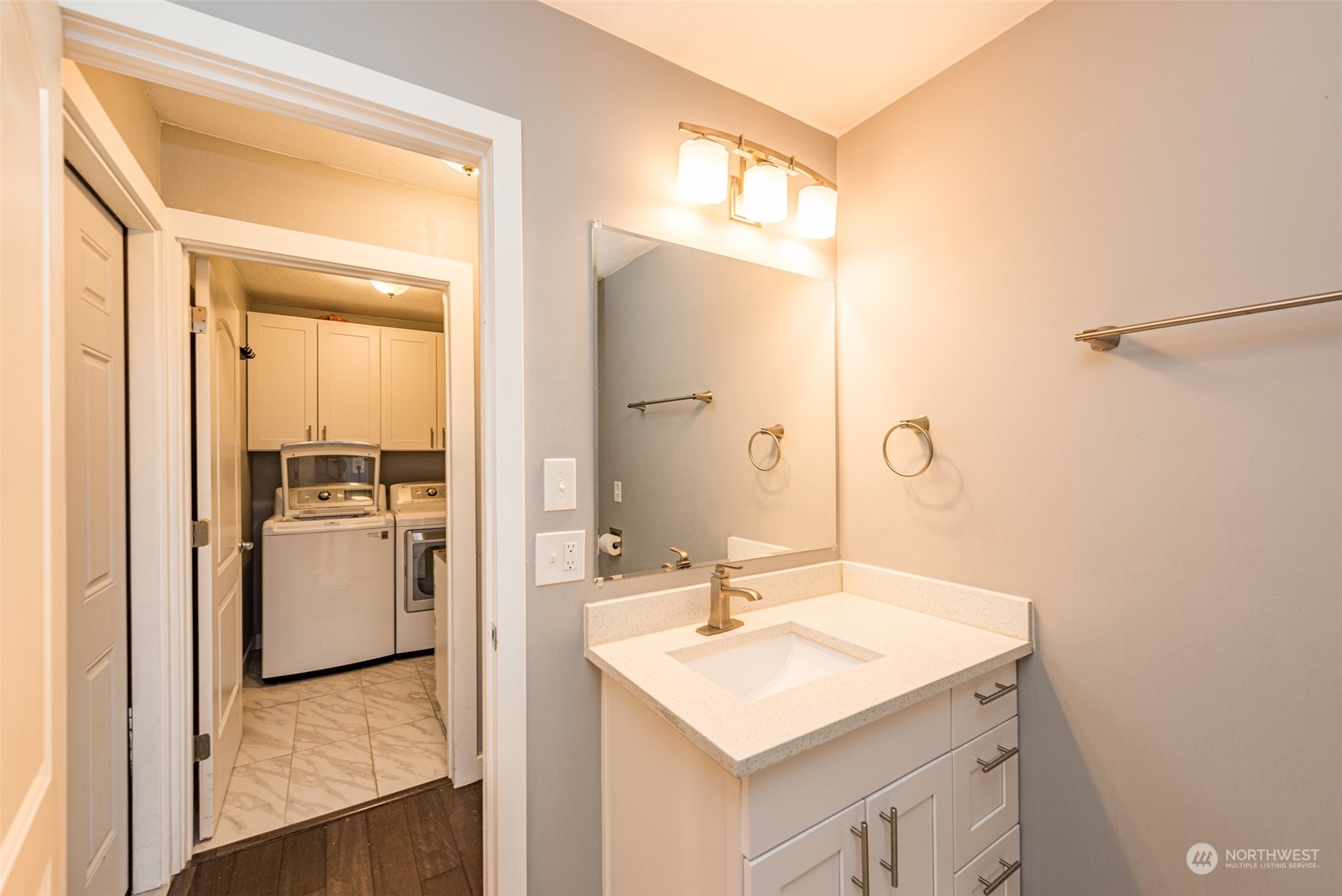 146 Sunset Place Sequim, WA 98382 - Photo 28 of 40 a bathroom with a sink a mirror and a shower