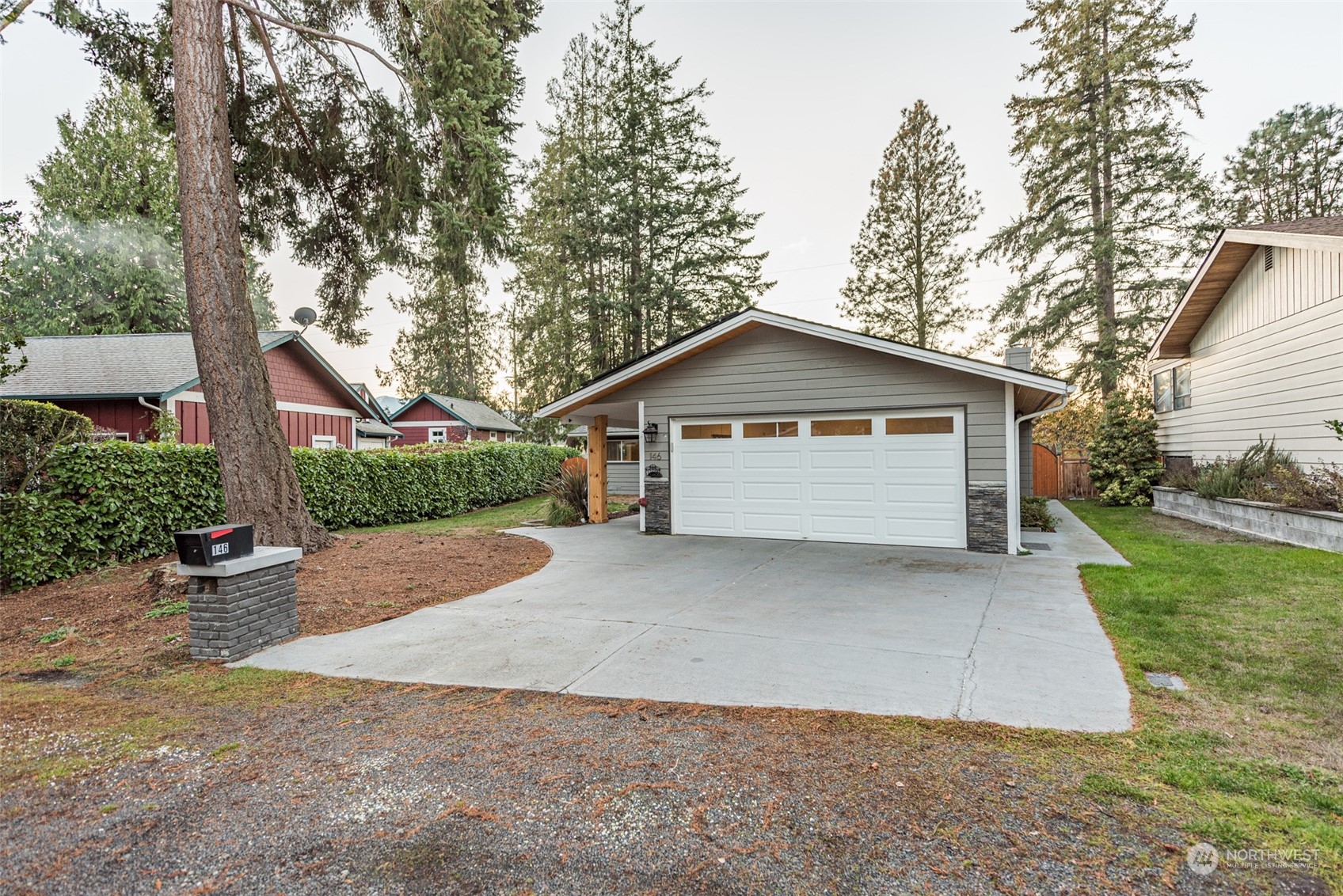 146 Sunset Place Sequim, WA 98382 - Photo 30 of 40 a view of garage and garden