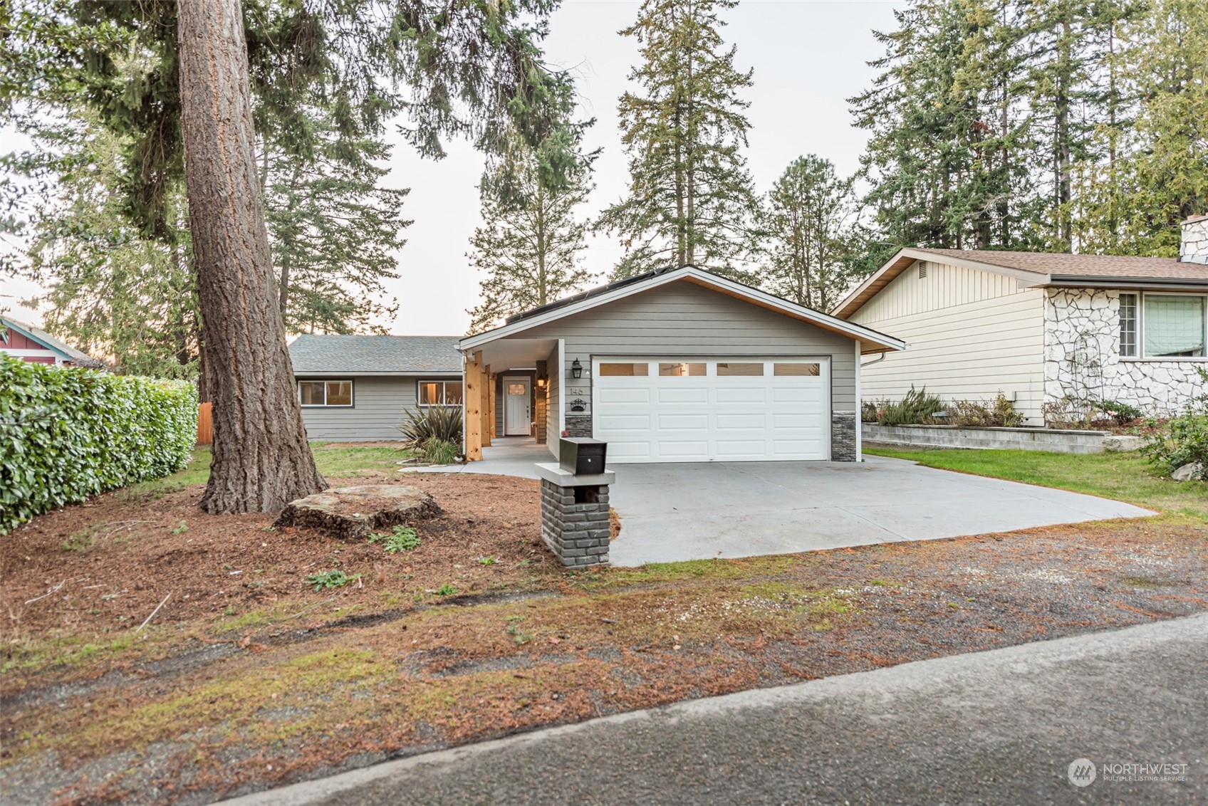 146 Sunset Place Sequim, WA 98382 - Photo 33 of 40 a view of a house with a yard and large tree