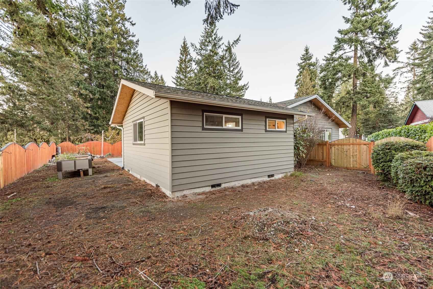 146 Sunset Place Sequim, WA 98382 - Photo 37 of 40 a view of a house with a yard and tree