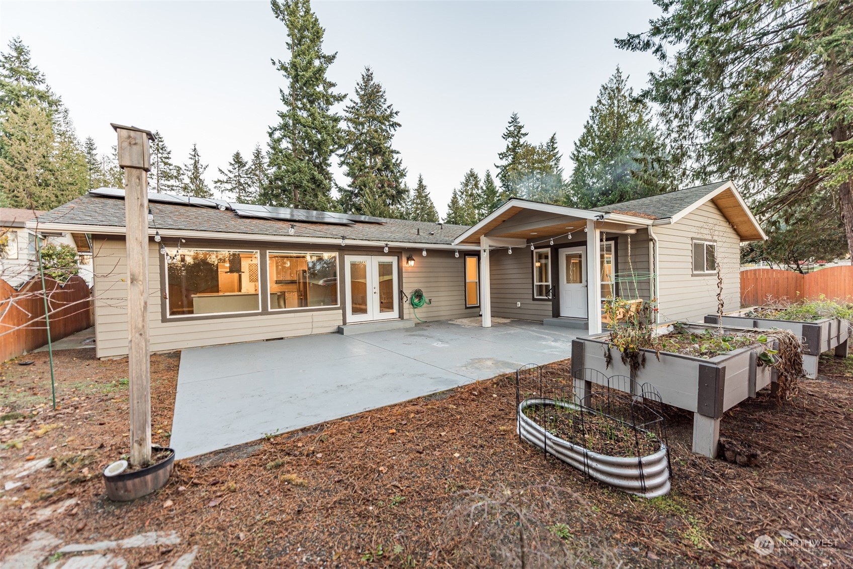 146 Sunset Place Sequim, WA 98382 - Photo 40 of 40 a front view of a house with a yard outdoor seating and garage