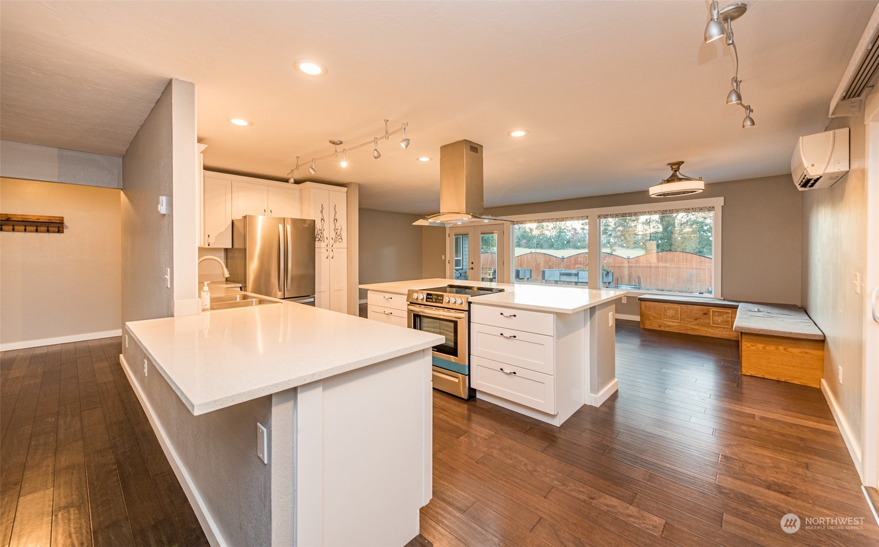 146 Sunset Place Sequim, WA 98382 - Photo 4 of 40 a kitchen with a stove a sink and a refrigerator