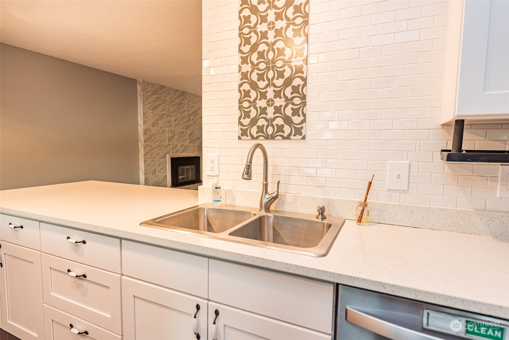 146 Sunset Place Sequim, WA 98382 - Photo 6 of 40 a kitchen with a sink and cabinets