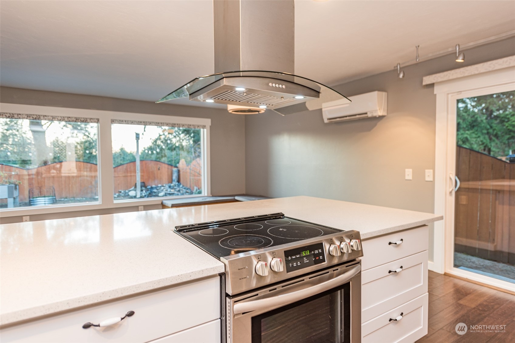 146 Sunset Place Sequim, WA 98382 - Photo 7 of 40 a stove top oven sitting inside of a kitchen