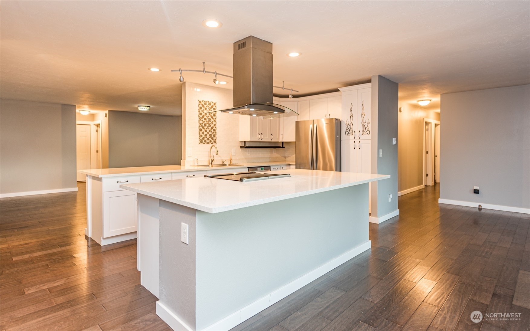 146 Sunset Place Sequim, WA 98382 - Photo 9 of 40 a kitchen with a sink cabinets and wooden floor