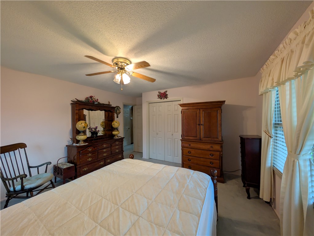 1000 Hickory Lane Anderson, SC 29624 - Photo 13 of 37 This cozy bedroom features a ceiling fan, soft lighting, and ample closet space.