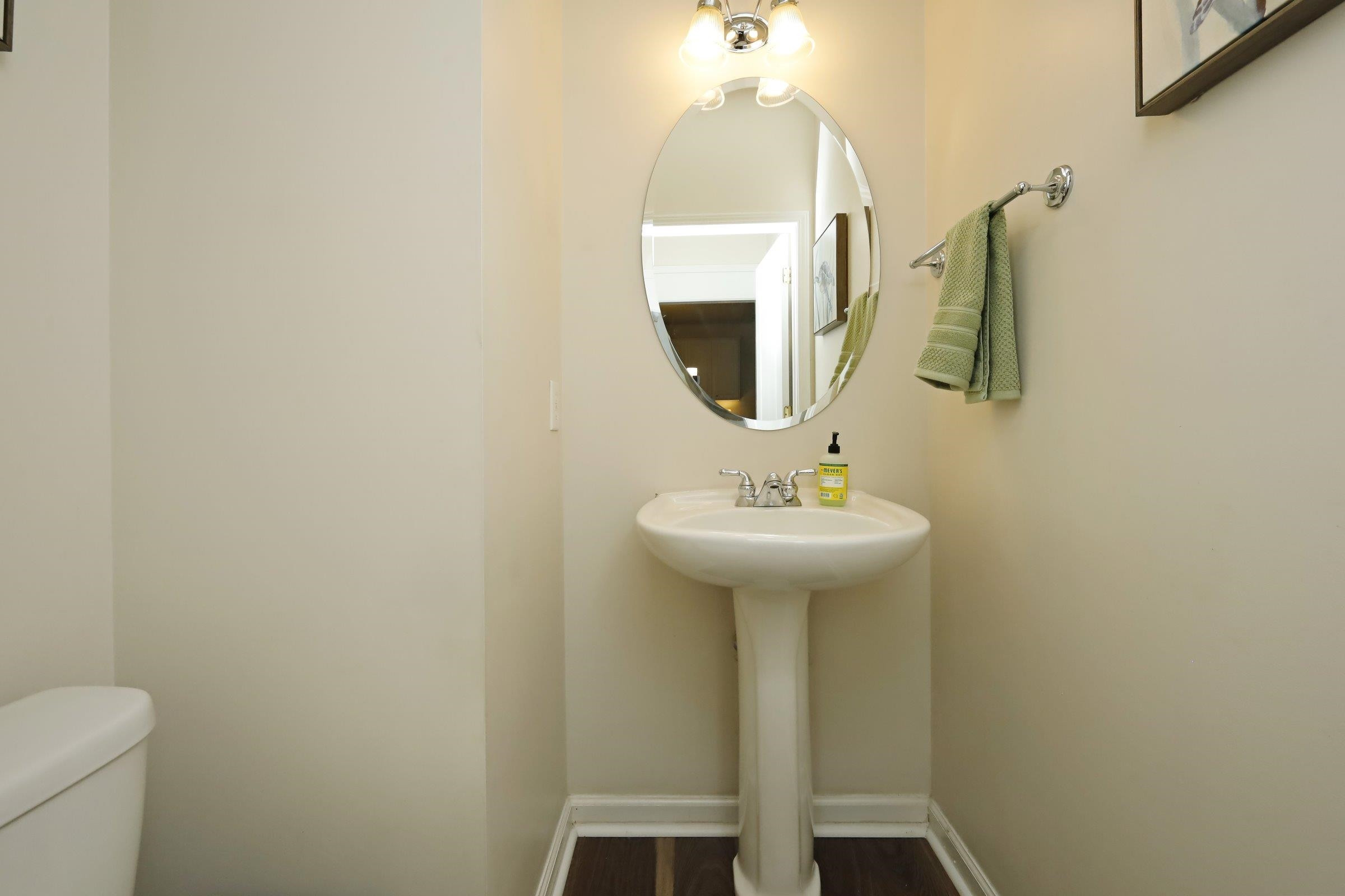 5313 Brandy Bay Road Raleigh, NC 27613 - Photo 20 of 42 a bathroom with a sink toilet and mirror