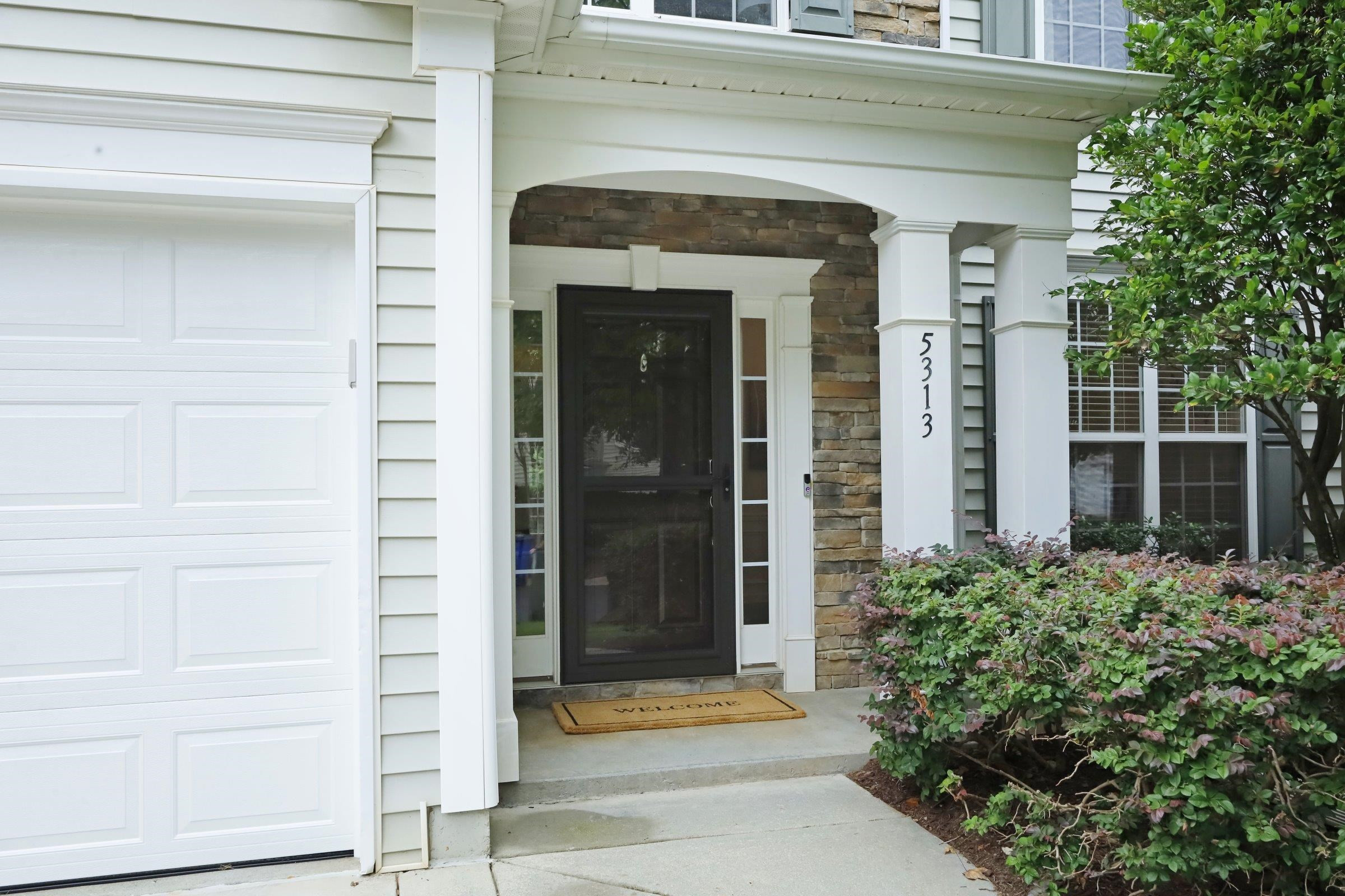 5313 Brandy Bay Road Raleigh, NC 27613 - Photo 2 of 42 a front view of a house with a glass door