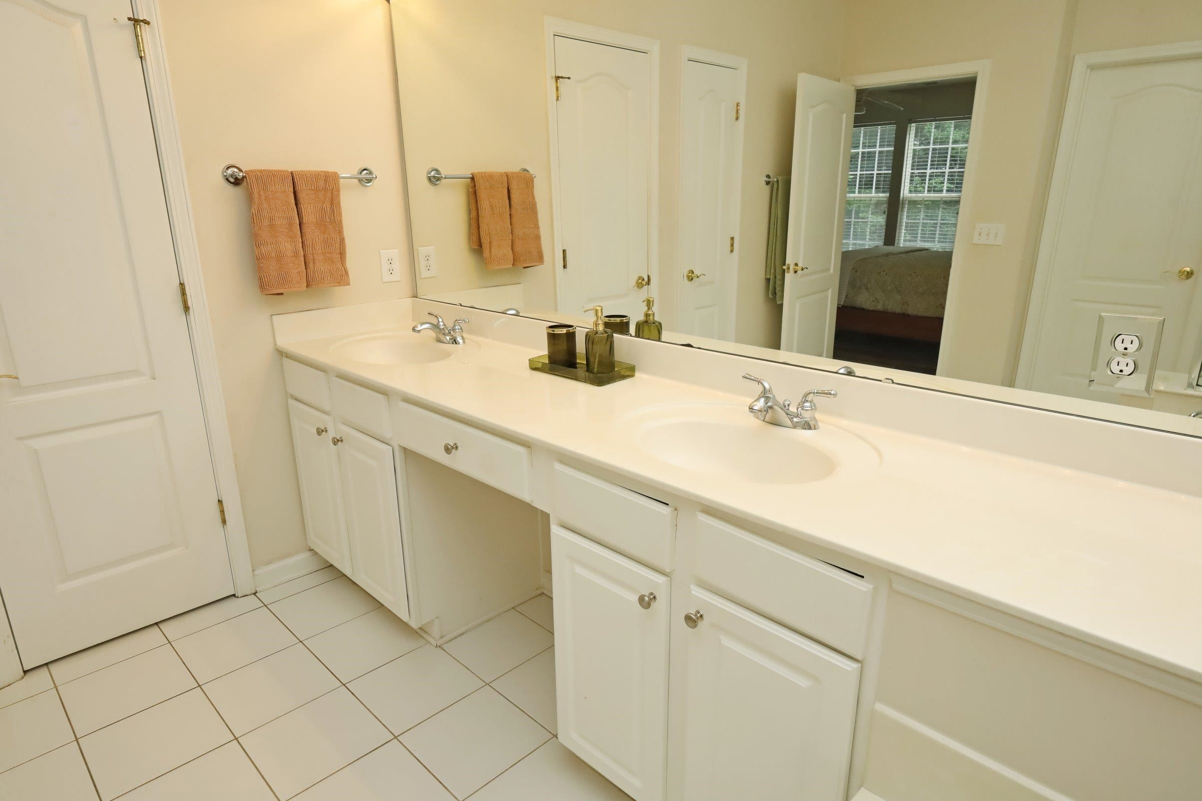 5313 Brandy Bay Road Raleigh, NC 27613 - Photo 25 of 42 a bathroom with a sink and a mirror
