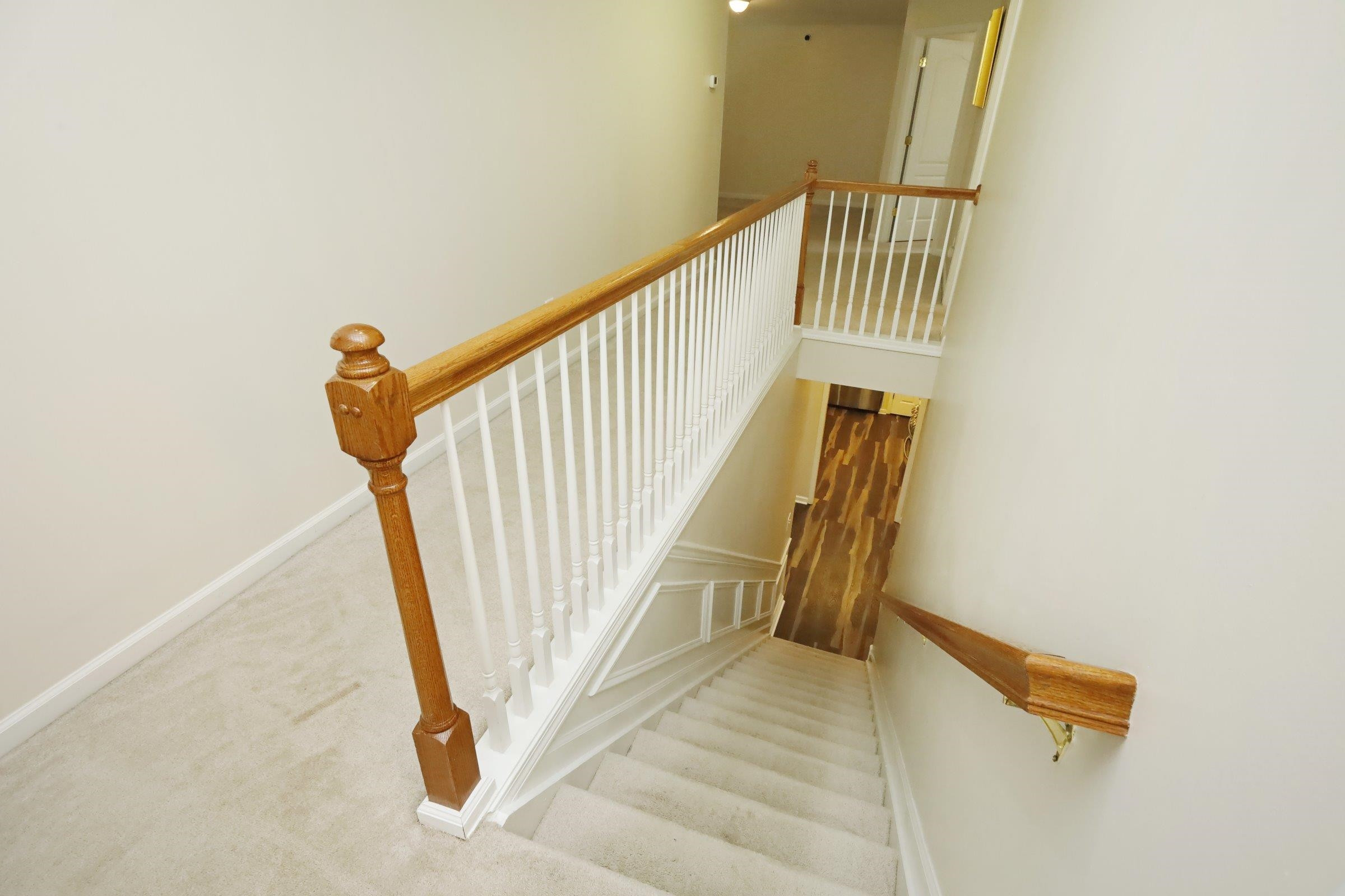 5313 Brandy Bay Road Raleigh, NC 27613 - Photo 28 of 42 a view of staircase with railing and white walls