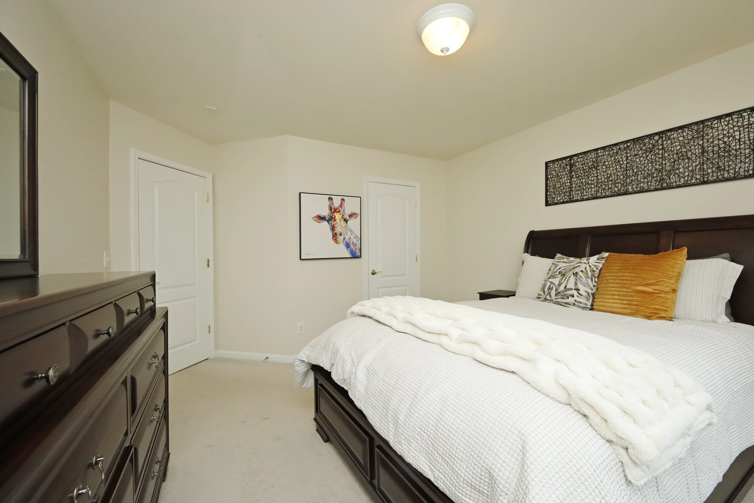 5313 Brandy Bay Road Raleigh, NC 27613 - Photo 32 of 42 a bedroom with a bed and a stove