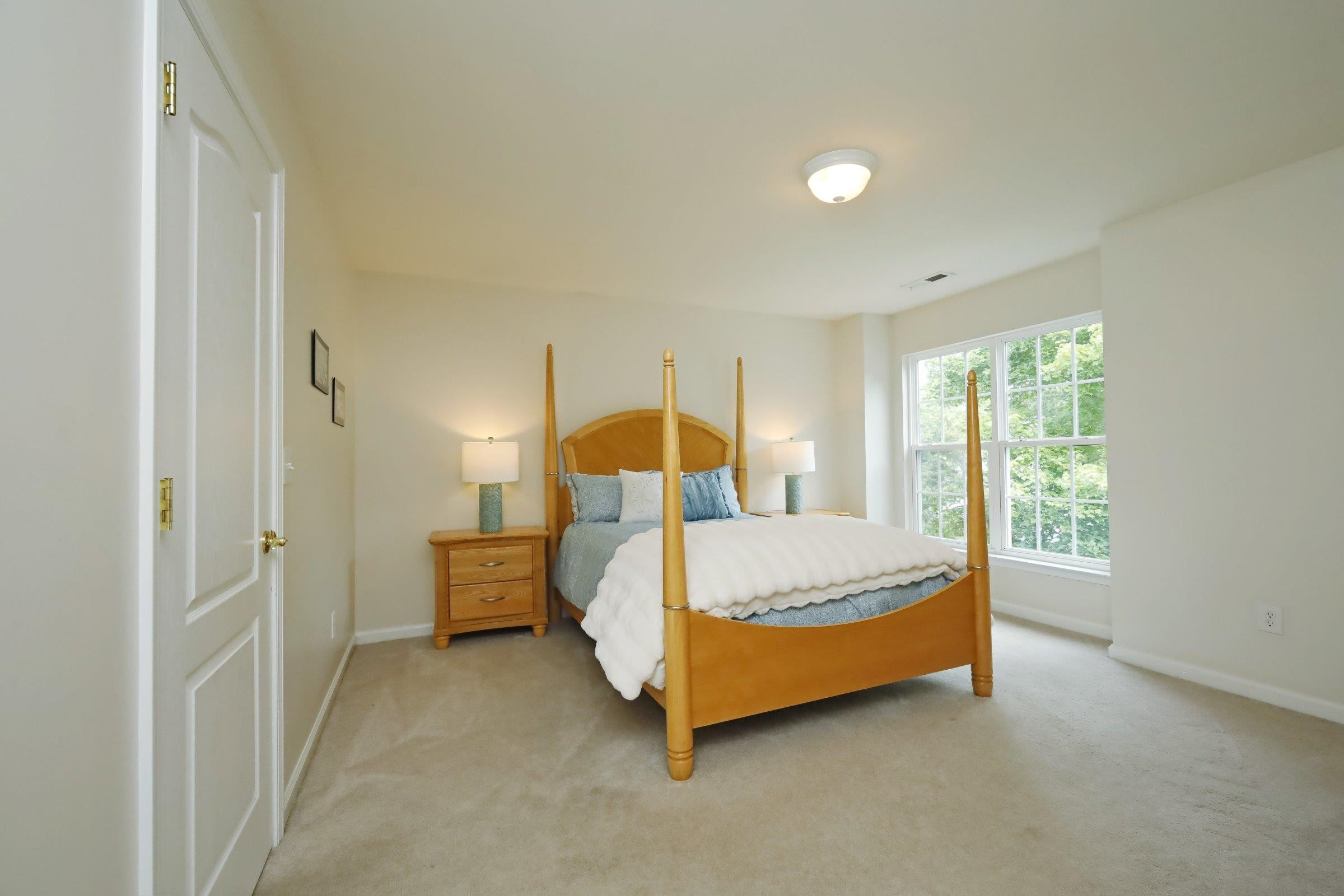 5313 Brandy Bay Road Raleigh, NC 27613 - Photo 33 of 42 a bed sitting in a bedroom next to a window