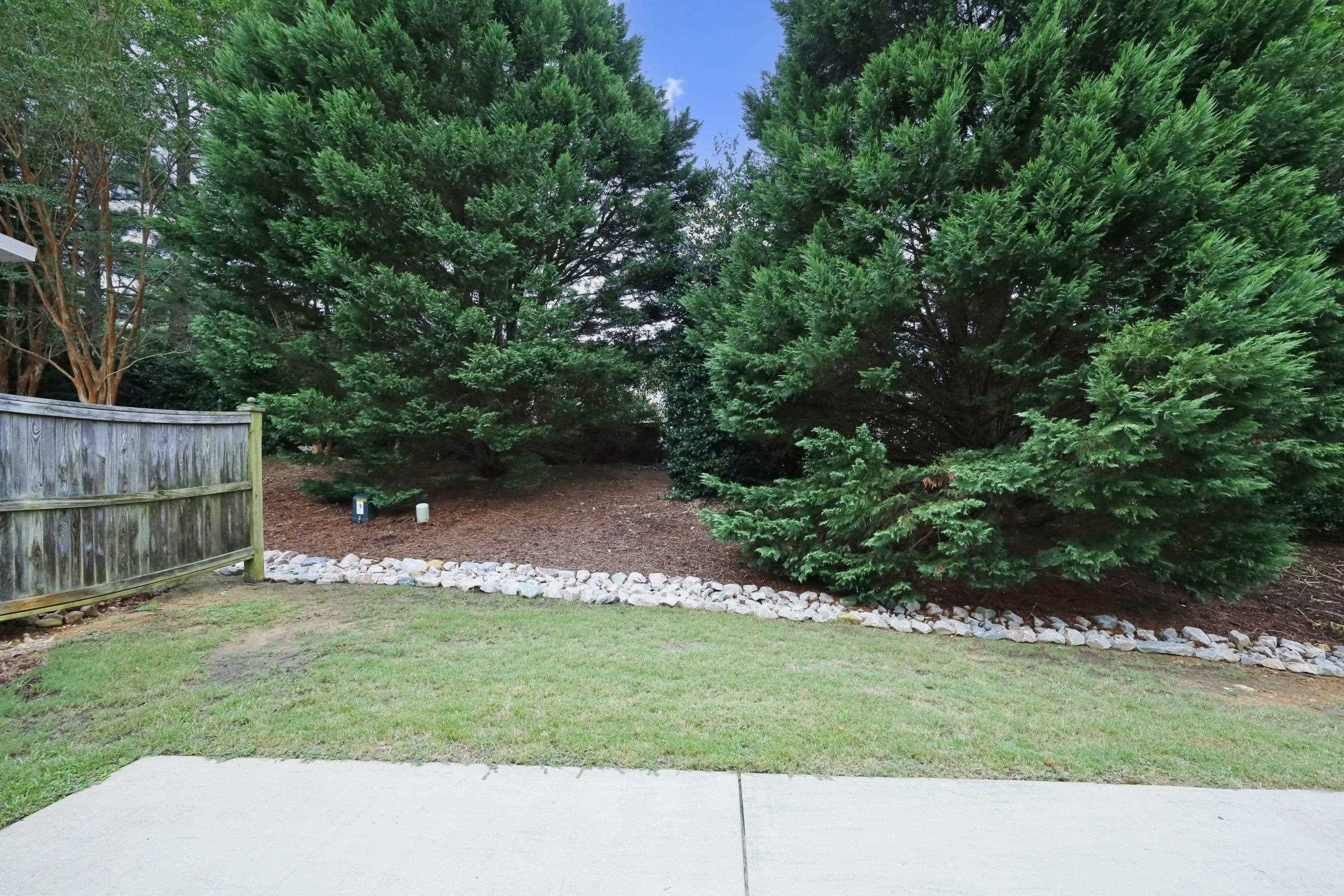 5313 Brandy Bay Road Raleigh, NC 27613 - Photo 39 of 42 a view of a backyard with a garden