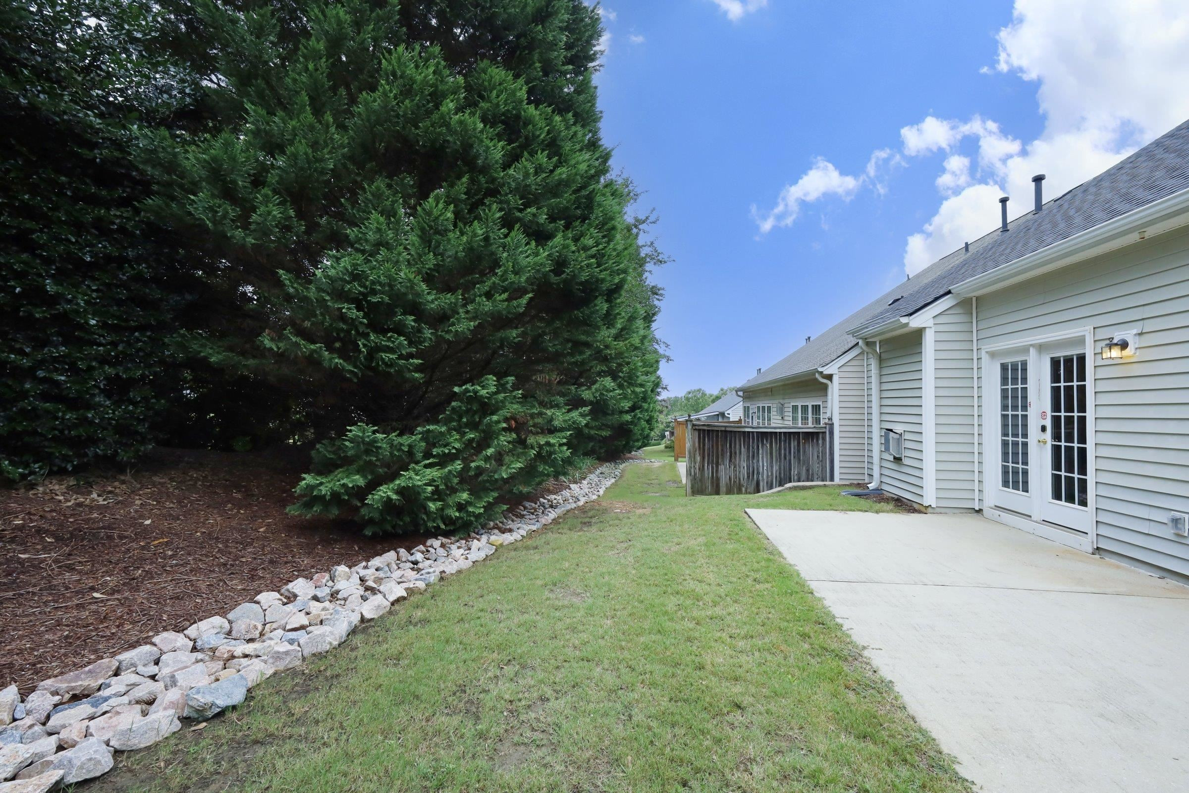 5313 Brandy Bay Road Raleigh, NC 27613 - Photo 40 of 42 a view of a house with backyard and garden