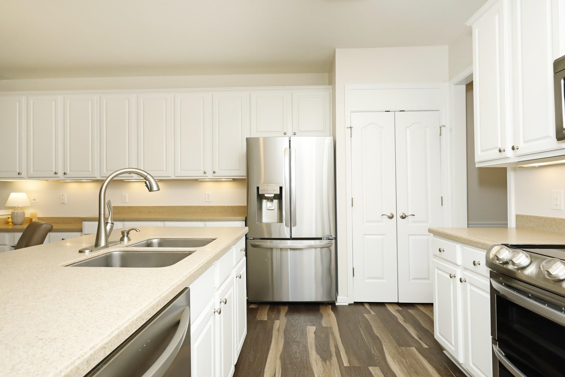 5313 Brandy Bay Road Raleigh, NC 27613 - Photo 8 of 42 a kitchen with a sink stove and refrigerator
