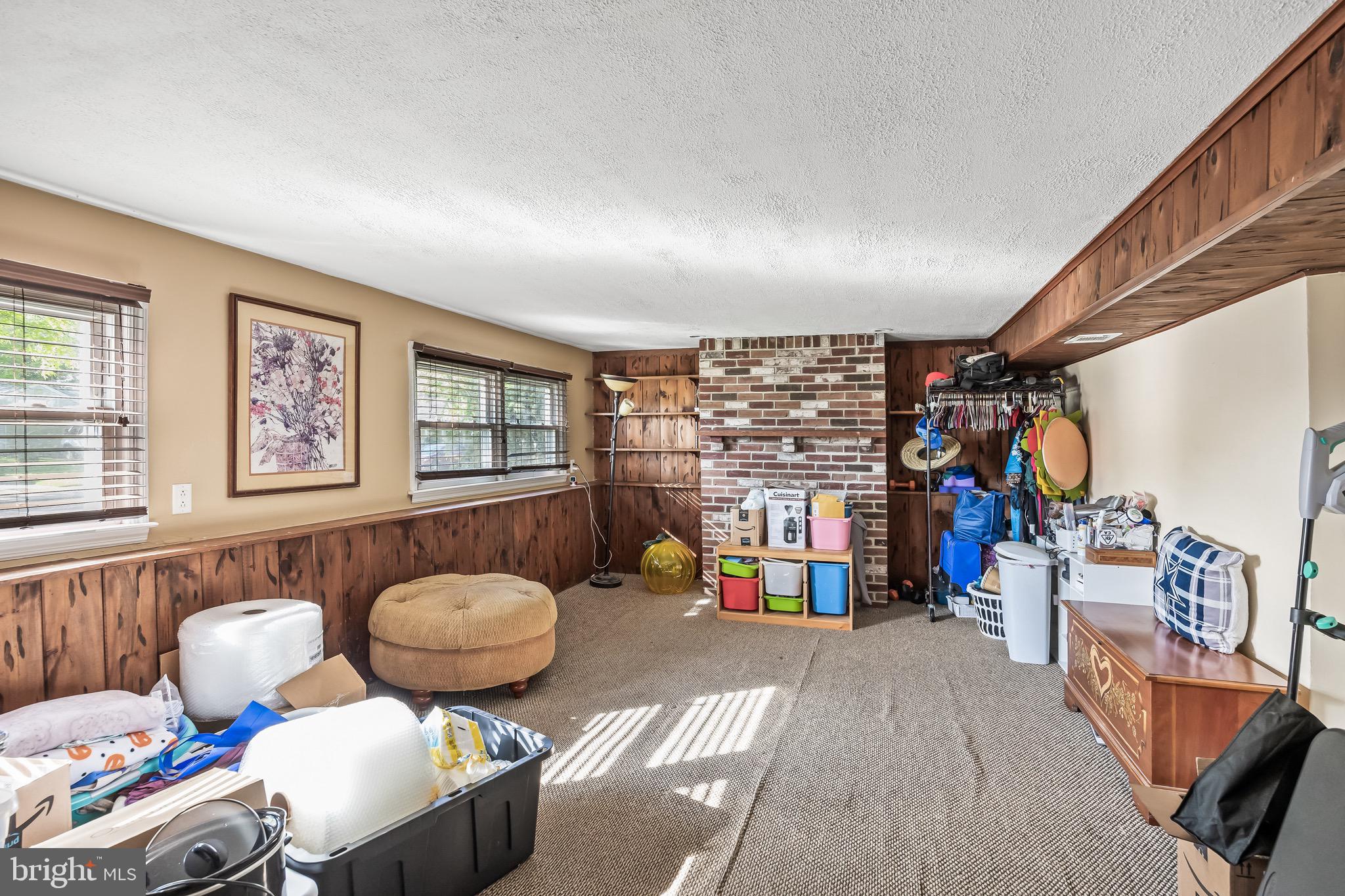 109 North Ambler Road Somers Point, NJ 08244 - Photo 15 of 22 a living room filled with furniture and a floor to ceiling window
