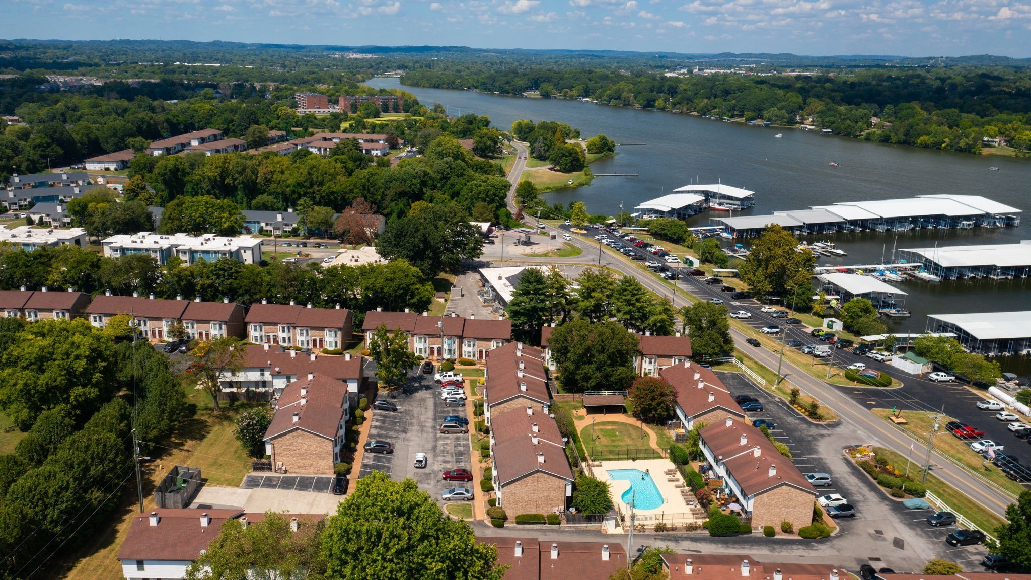 an aerial view of residential houses with outdoor space