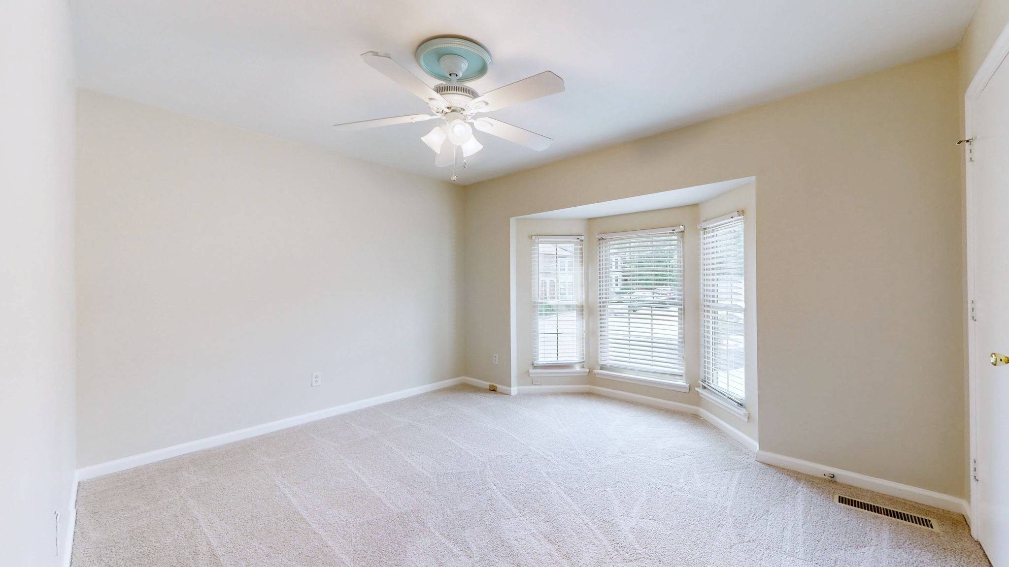 250 Sanders Ferry Road, Unit 34 Hendersonville, TN 37075 - Photo 16 of 21 an empty room with chandelier fan and windows
